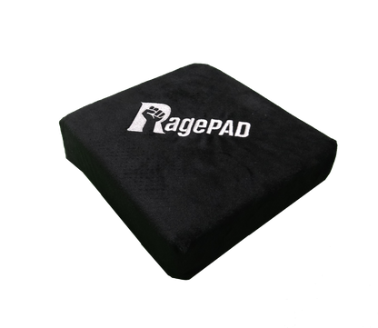 Black padded gamer rage cushion with white fist logo and 'RagePAD' text on top
