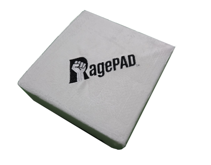 White RagePAD gaming stress relief pad with embroidered fist logo on top surface